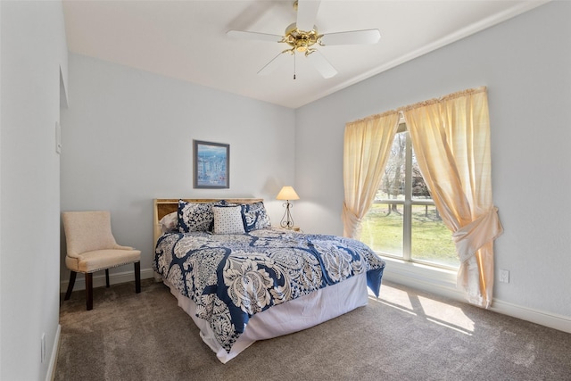 bedroom with ceiling fan, baseboards, and carpet