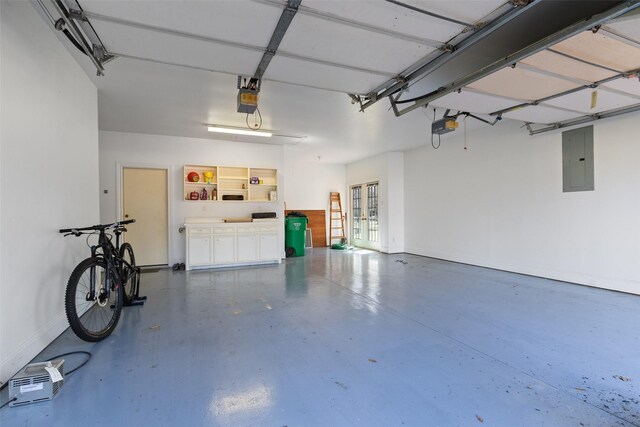 garage with electric panel, french doors, baseboards, and a garage door opener