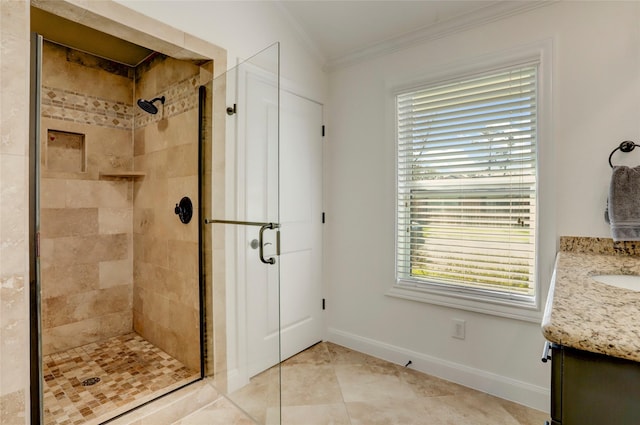 full bath with vanity, ornamental molding, and a shower stall