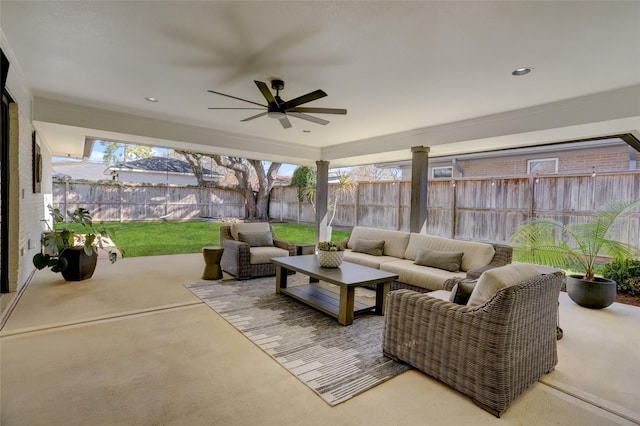 view of patio / terrace featuring ceiling fan, a fenced backyard, and outdoor lounge area