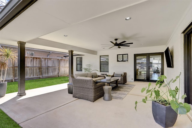 view of patio with an outdoor living space, french doors, a ceiling fan, and fence