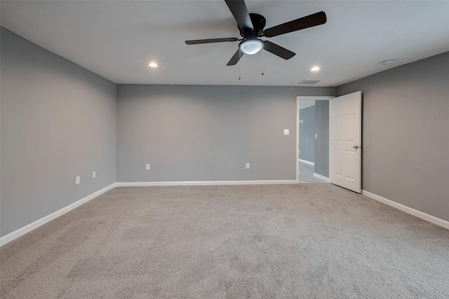 empty room featuring visible vents, a ceiling fan, recessed lighting, carpet floors, and baseboards