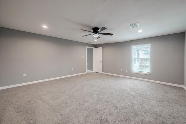 empty room with visible vents, recessed lighting, carpet flooring, and baseboards