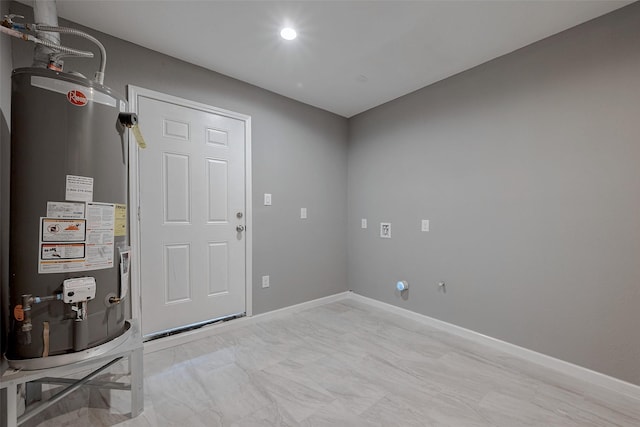 utility room with gas water heater