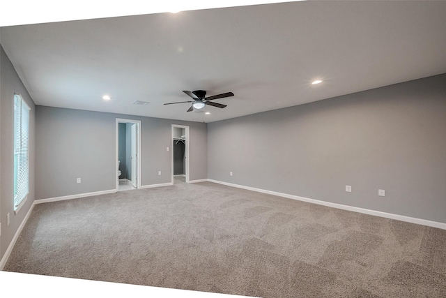 spare room featuring carpet flooring, recessed lighting, a ceiling fan, and baseboards