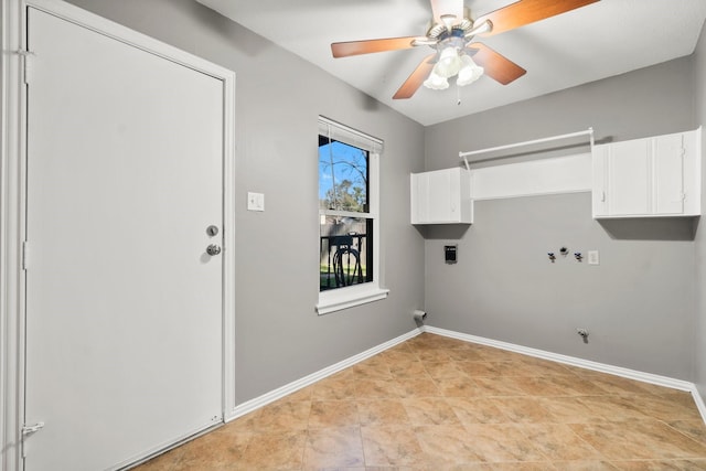 laundry area featuring cabinet space, hookup for a washing machine, baseboards, and hookup for a gas dryer