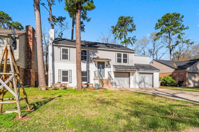 raised ranch with an attached garage, a chimney, concrete driveway, a front lawn, and brick siding