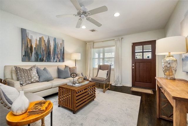 living room featuring recessed lighting, dark wood-style floors, visible vents, and ceiling fan