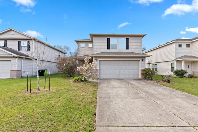 view of front facade with a front yard, an attached garage, and driveway