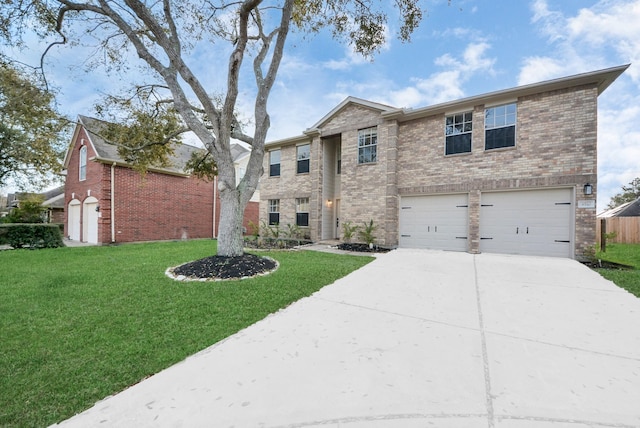 view of front of home with driveway, brick siding, an attached garage, and a front lawn