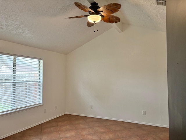 empty room featuring a ceiling fan, baseboards, visible vents, vaulted ceiling, and a textured ceiling