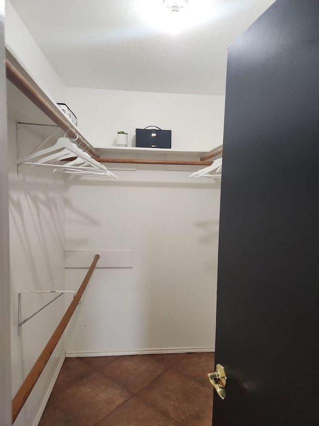 spacious closet with tile patterned flooring