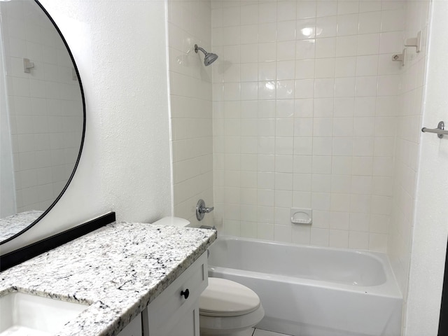 bathroom featuring a textured wall, toilet, vanity, and shower / tub combination