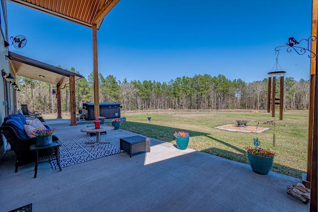 view of patio with a wooded view