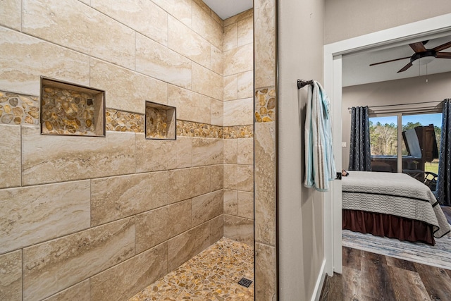 full bath featuring a ceiling fan, walk in shower, wood finished floors, and ensuite bathroom