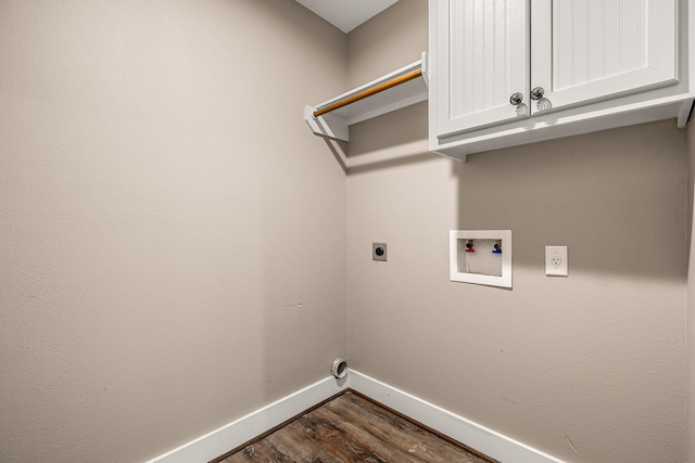 laundry room with baseboards, cabinet space, dark wood-style flooring, electric dryer hookup, and washer hookup