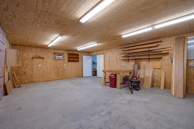 basement with wood ceiling, wood walls, and a wall mounted AC