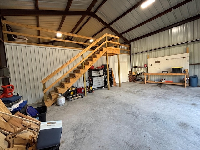 garage featuring metal wall and a workshop area