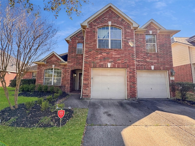 traditional-style house with brick siding, driveway, and an attached garage