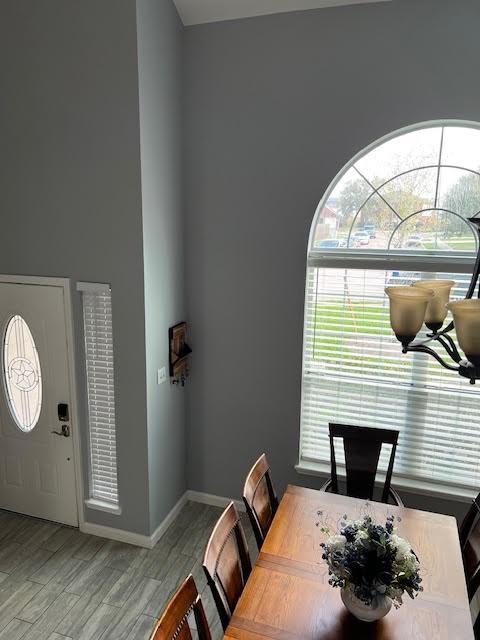 dining room featuring baseboards and wood finished floors