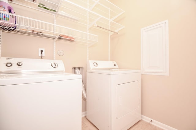 laundry room featuring laundry area, independent washer and dryer, and baseboards