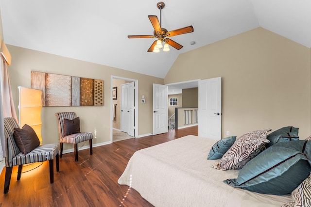 bedroom with baseboards, high vaulted ceiling, wood finished floors, and a ceiling fan