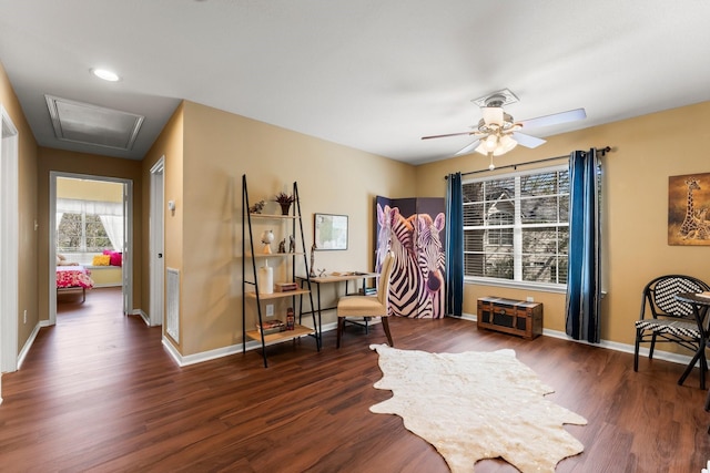 sitting room featuring visible vents, ceiling fan, baseboards, and wood finished floors