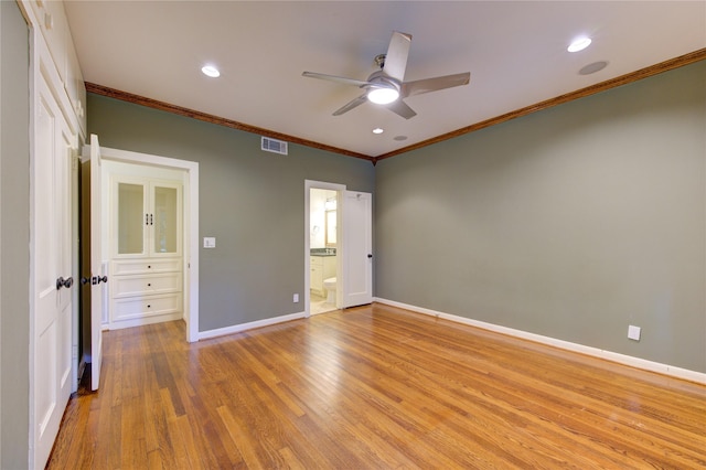 unfurnished bedroom with light wood finished floors, visible vents, crown molding, baseboards, and recessed lighting