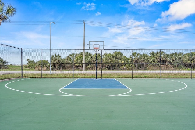 view of basketball court featuring community basketball court and fence