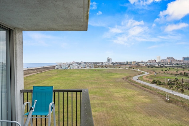 view of yard with a view of city and a water view