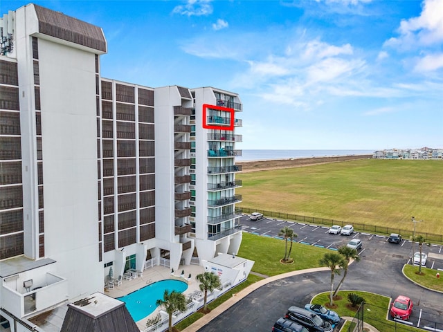 view of building exterior with a water view