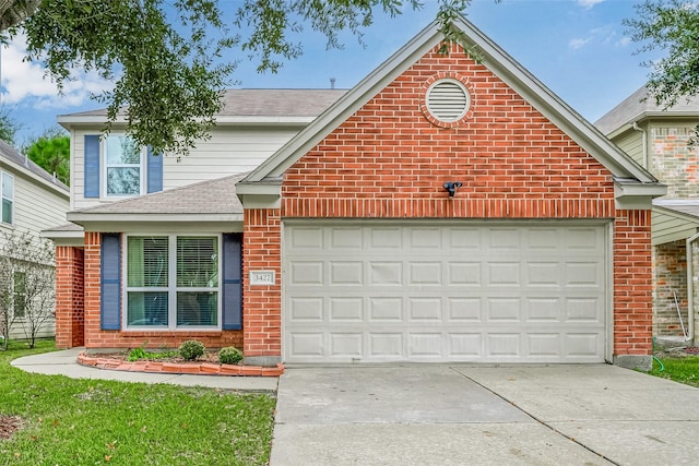 traditional home with brick siding, an attached garage, driveway, and roof with shingles