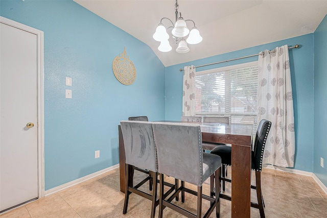 dining space with tile patterned flooring, an inviting chandelier, baseboards, and vaulted ceiling