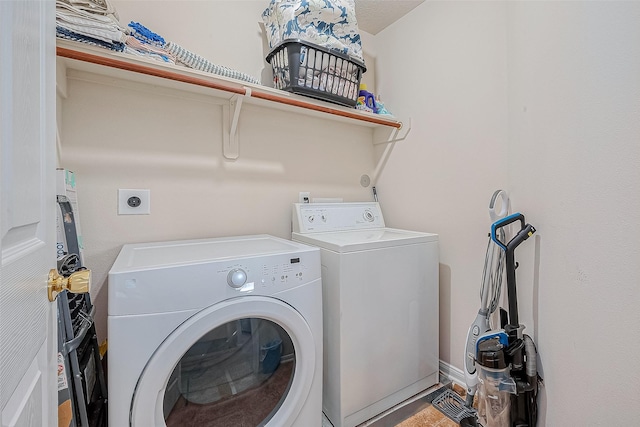 laundry area featuring laundry area and washer and clothes dryer