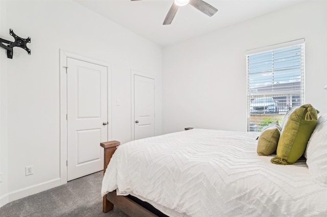 bedroom featuring carpet flooring, baseboards, and a ceiling fan