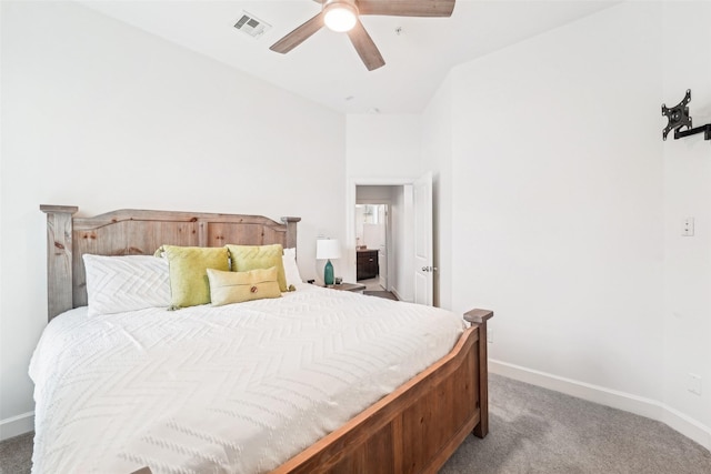 carpeted bedroom featuring visible vents, baseboards, and ceiling fan