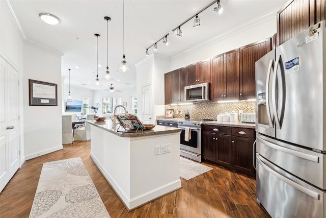 kitchen with dark wood-style floors, a kitchen island with sink, stainless steel appliances, crown molding, and backsplash