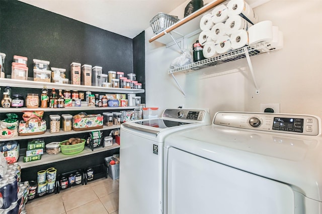 laundry area with tile patterned floors, independent washer and dryer, and laundry area