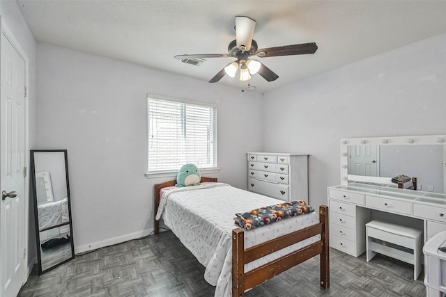 bedroom featuring visible vents, ceiling fan, and baseboards