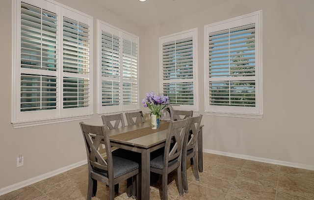 dining area featuring baseboards