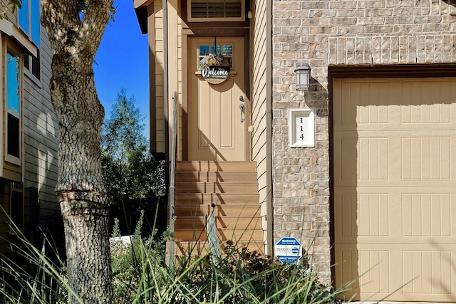 entrance to property featuring stone siding