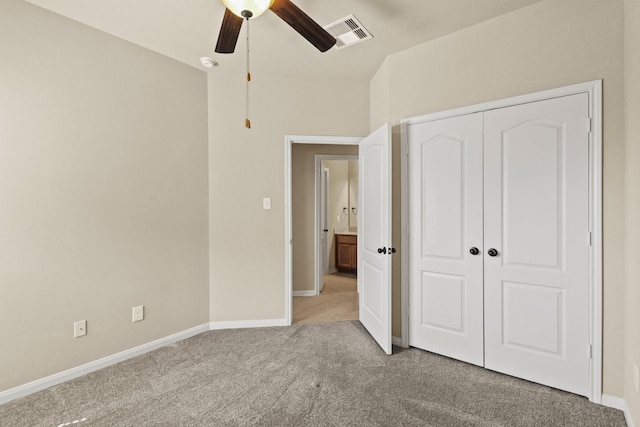 unfurnished bedroom featuring a ceiling fan, carpet, visible vents, baseboards, and a closet