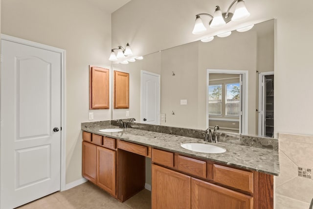 bathroom featuring a sink, double vanity, and tile patterned flooring