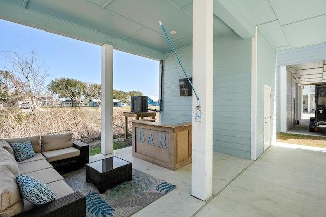 view of patio / terrace with central air condition unit and outdoor lounge area