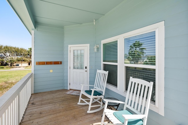 wooden terrace featuring a porch