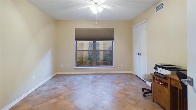 unfurnished office featuring visible vents, baseboards, and ceiling fan