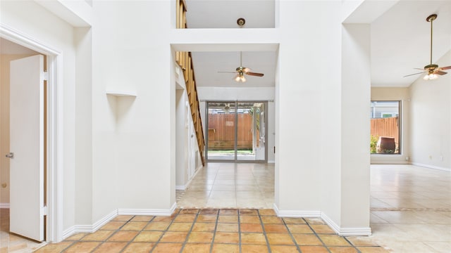 2026 Ashford Hollow Ln, Houston, TX 77077 - hall featuring tile patterned flooring, baseboards, and lofted ceiling
