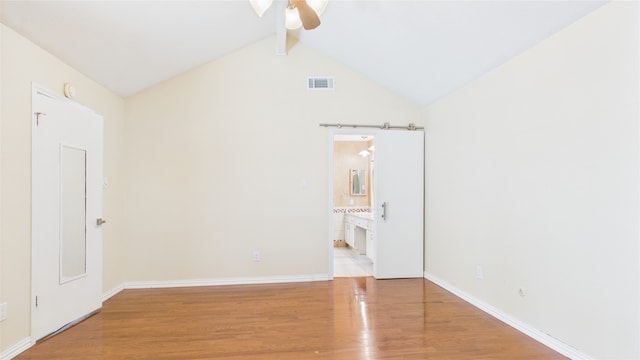 2026 Ashford Hollow Ln, Houston, TX 77077 - unfurnished bedroom with wood finished floors, baseboards, connected bathroom, and ceiling fan