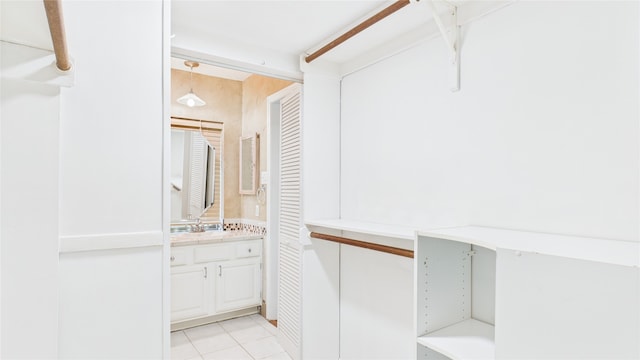 2026 Ashford Hollow Ln, Houston, TX 77077 - walk in closet with light tile patterned floors