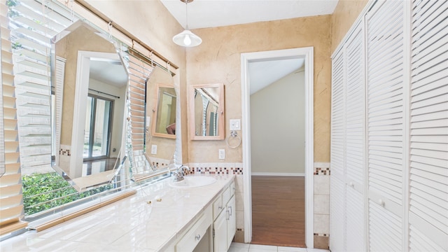 2026 Ashford Hollow Ln, Houston, TX 77077 - bathroom featuring a closet, vanity, tile walls, and tile patterned floors